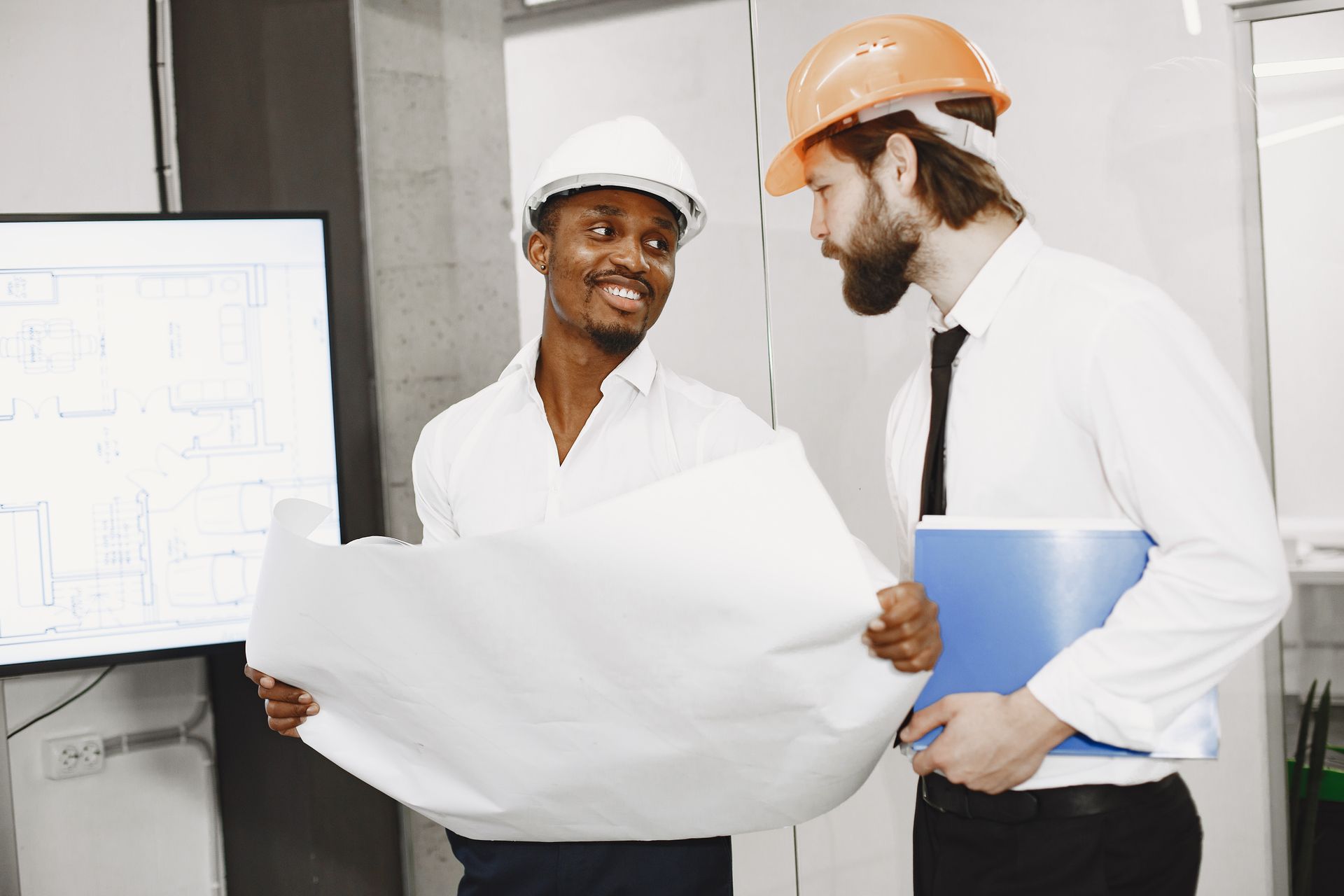 Engineers reviewing building plans
